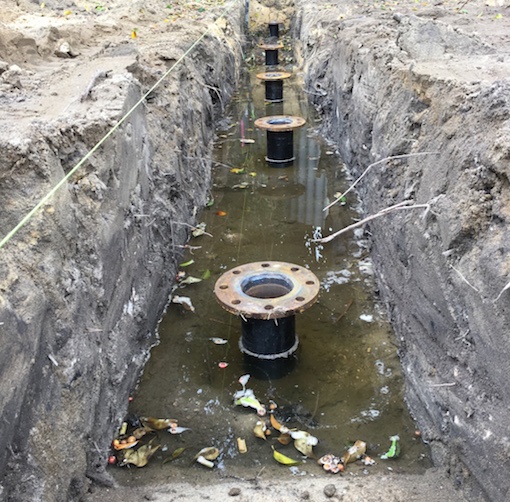Screw piles installed through high water table